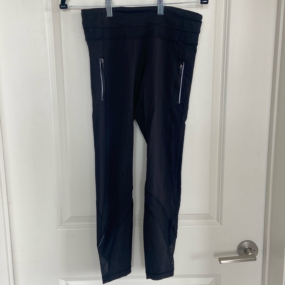 Cropped Lululemon black leggings with mesh detail